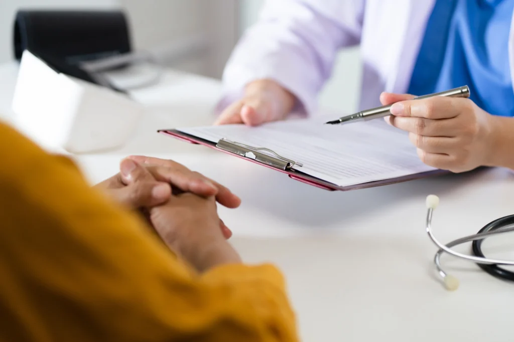 Suboxone Taper Schedule: A medical professional explaining the information on a clipboard to a patient.