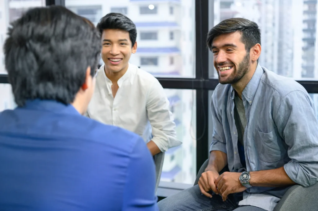 Men's Recovery: A group of men sitting together talking.