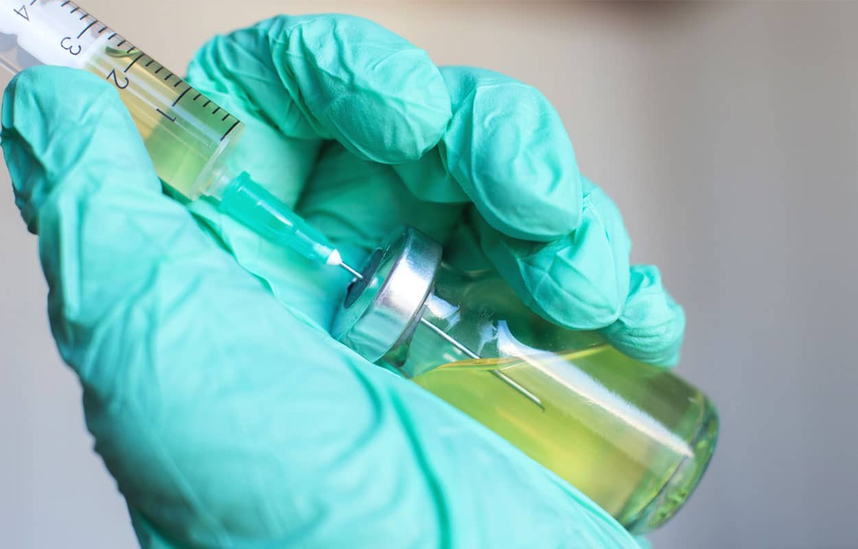 When Was Sublocade FDA Approved? A gloved hand holding a syringe.