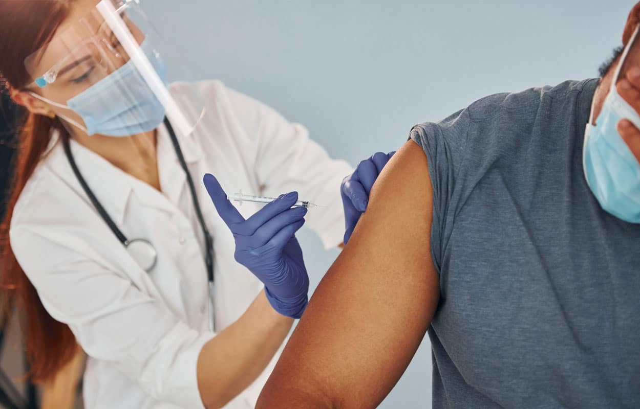 How Long Does Sublocade Stay In Your System: A medical professional injecting Sublocade into the arm of a patient.