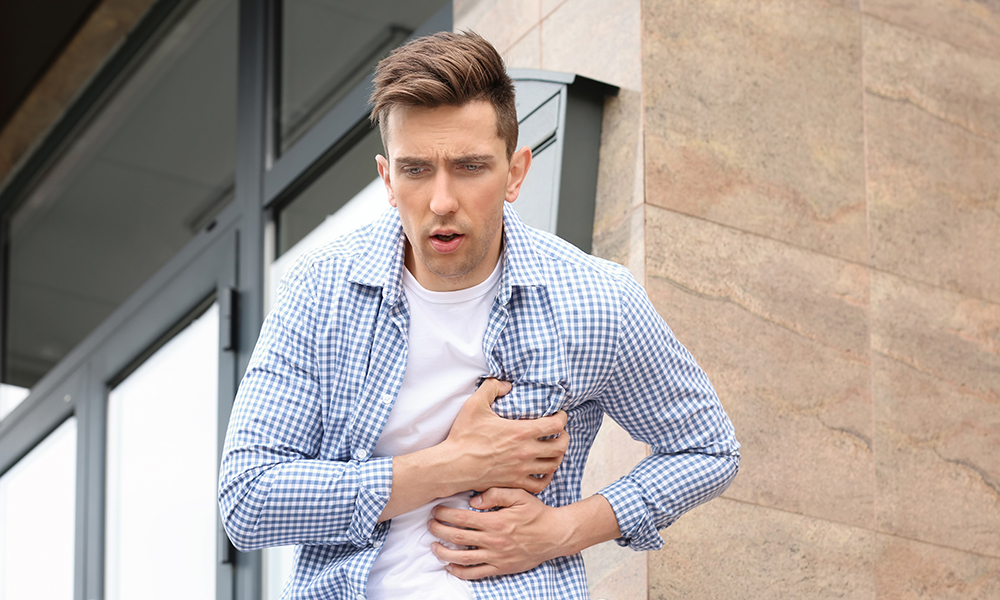 Common warning signs include chest pain or tightness and a rapid pulse.